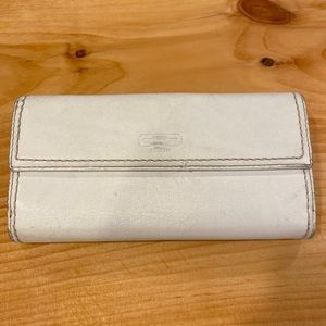 White coach wallet; 7”x4”; fair condition